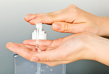 Person using hand sanitizer