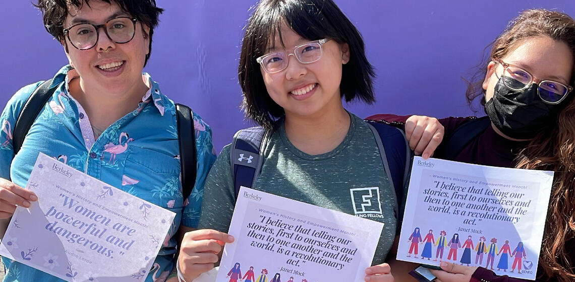 Students hold quotes from notable women on Sproul during Women's History and Empowerment Month